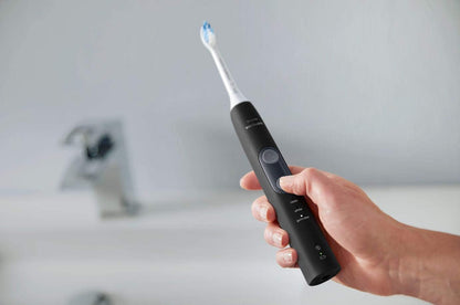 Protectiveclean 5300 Rechargeable Electric Toothbrush, with Pressure Sensor, 3 Cleaning Modes, Smartimer and Quadpacer, with 2 Bonus Brush Heads, Travel Case, Black, Model HX6423/34